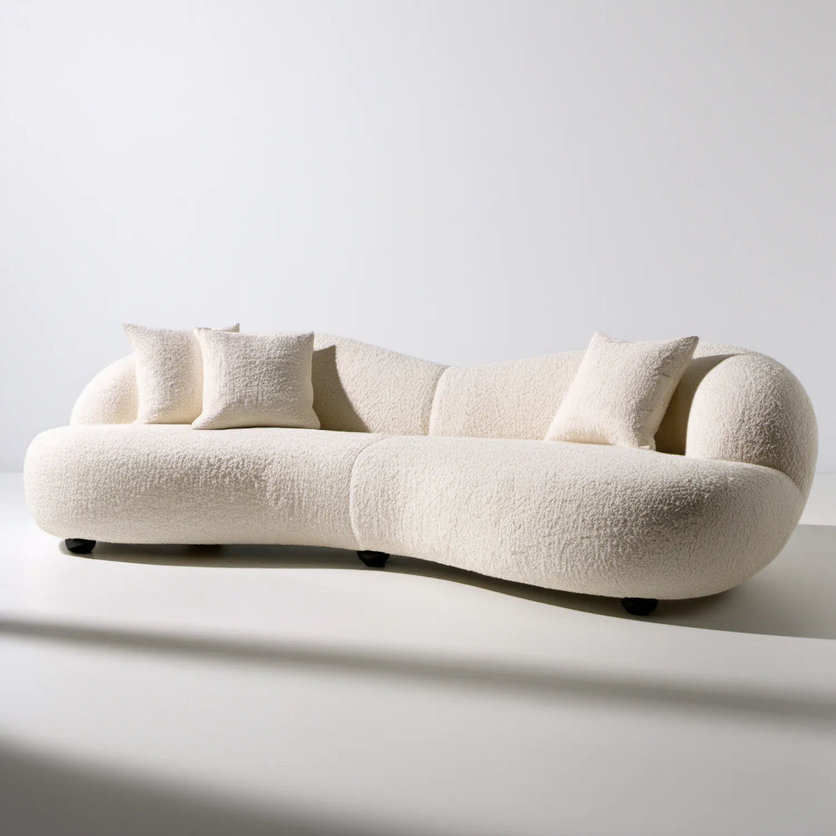 Trzyosobowa sofa łukowa bouclé kremowa/czarna, 230 x 100 x 75 cm